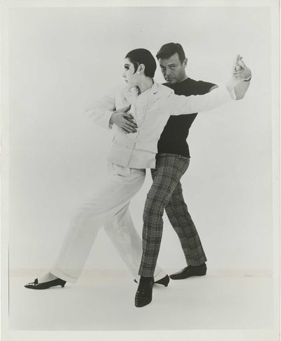 1|11  Rudi Gernreich with Peggy Moffitt modeling the “Marlene Dietrich”pantsuit, 1964.Photograph © William Claxton, LLC, courtesy of Demont Photo Management & Fahey/Klein Gallery Los Angeles, with permission of the Rudi Gernreich trademark. Rudi Gernreich papers (Collection 1702). Library Special Collections, Charles E. Young Research Library, UCLA.